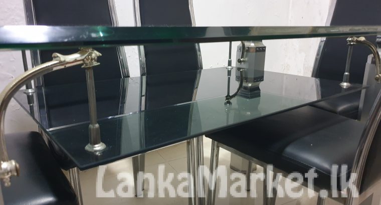 Used glass dining table and glass coffee table for sale.